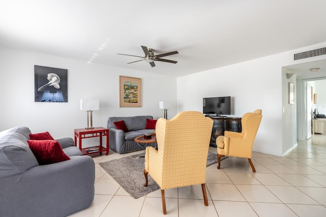 living room with light tile patterned flooring and ceiling fan