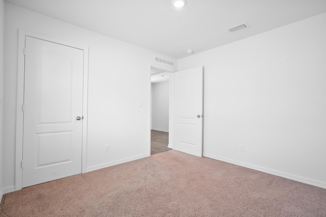 unfurnished bedroom featuring carpet flooring