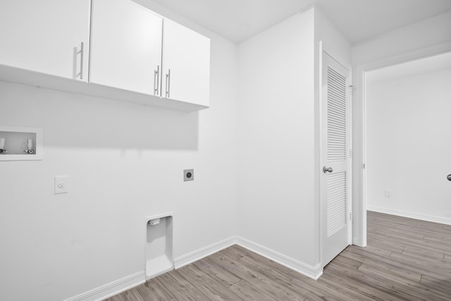 laundry area featuring cabinets, washer hookup, hookup for an electric dryer, and light hardwood / wood-style flooring