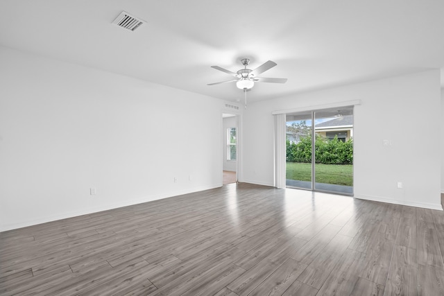 unfurnished room with ceiling fan and light wood-type flooring