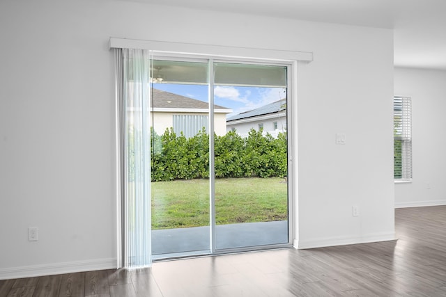 doorway to outside with hardwood / wood-style flooring