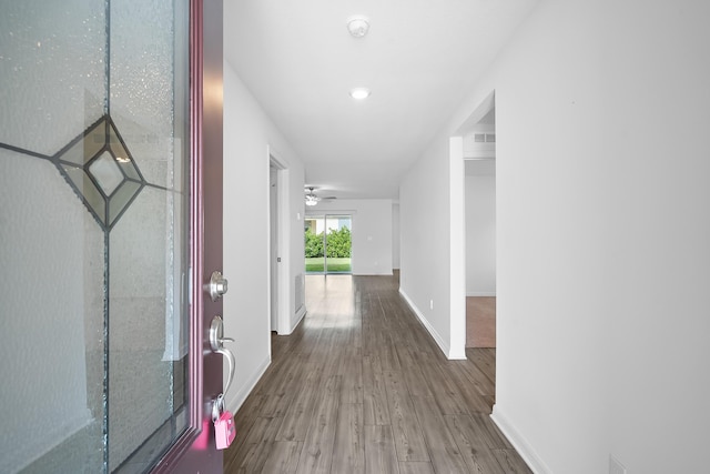 corridor featuring hardwood / wood-style flooring