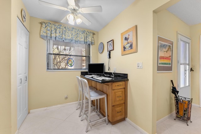 office space with ceiling fan and light tile patterned floors