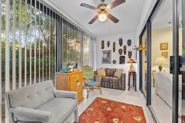 sunroom / solarium with ceiling fan