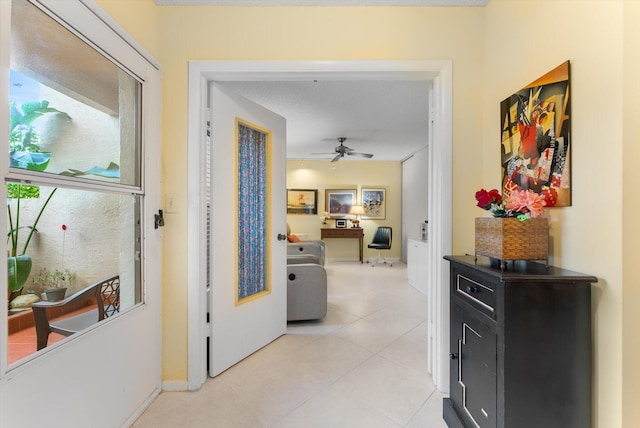 hallway with light tile patterned floors