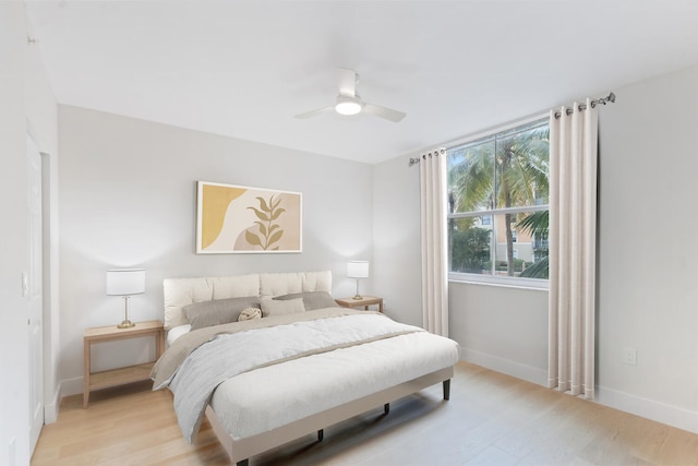 bedroom featuring ceiling fan and light hardwood / wood-style flooring