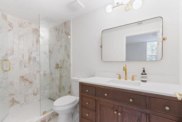 bathroom with vanity, toilet, and an enclosed shower