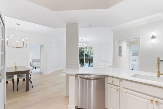 kitchen with sink, dishwasher, a notable chandelier, white cabinets, and light wood-type flooring