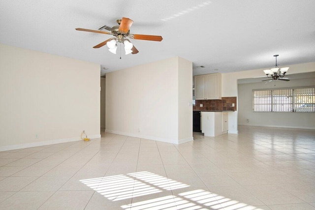 unfurnished living room featuring light tile patterned floors and a chandelier