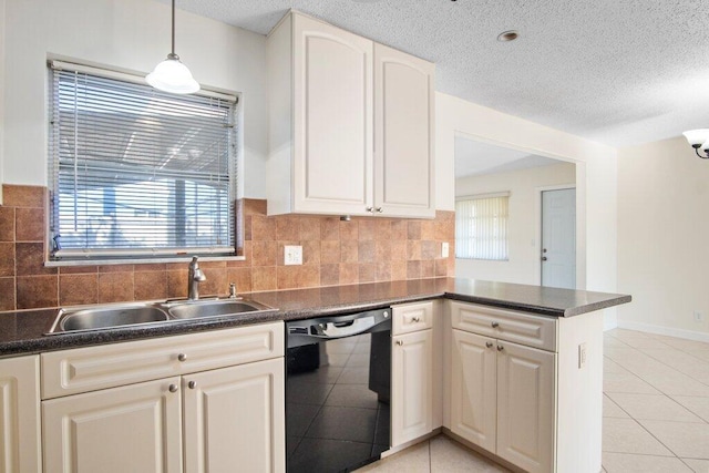 kitchen with dishwasher, sink, light tile patterned floors, decorative light fixtures, and kitchen peninsula