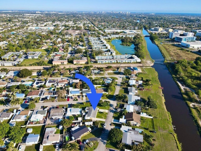 aerial view featuring a water view and a residential view