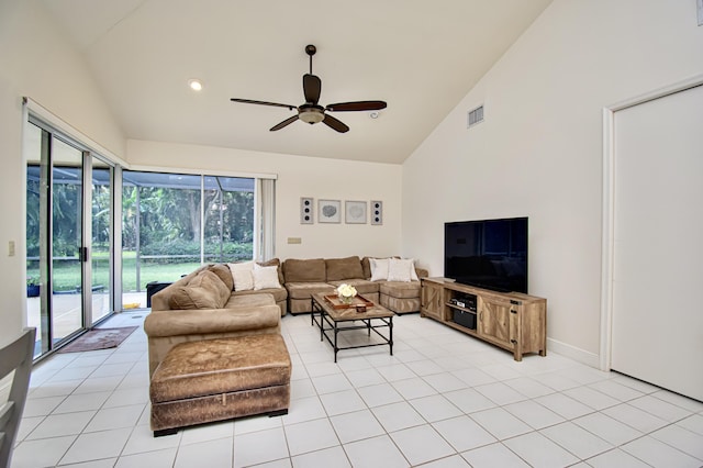 tiled living room featuring high vaulted ceiling and ceiling fan