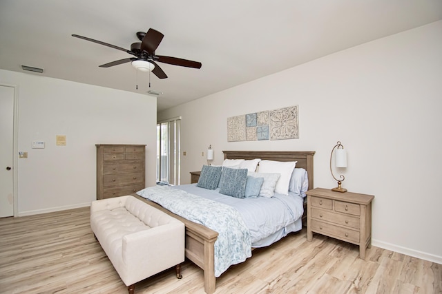 bedroom with ceiling fan and light hardwood / wood-style flooring