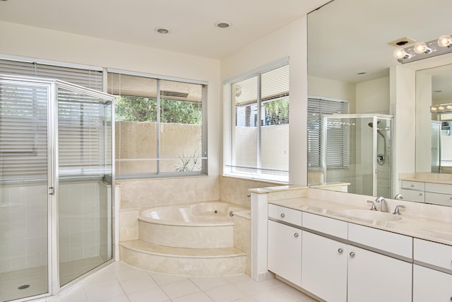 bathroom with vanity, independent shower and bath, and tile patterned flooring