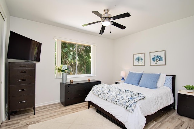 bedroom featuring ceiling fan and light hardwood / wood-style flooring