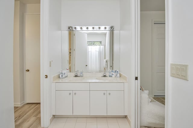 bathroom featuring vanity and tile patterned flooring