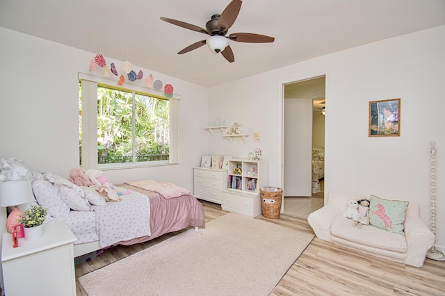 bedroom featuring hardwood / wood-style floors and ceiling fan