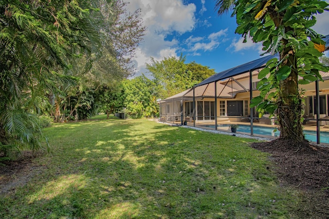 view of yard featuring glass enclosure