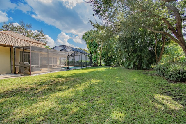 view of yard featuring a lanai