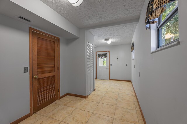 kitchen with light tile patterned floors, gray cabinets, stainless steel appliances, and wood ceiling