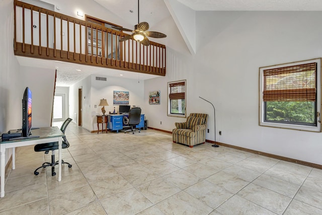 interior space with ceiling fan and high vaulted ceiling