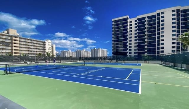 view of sport court with basketball hoop