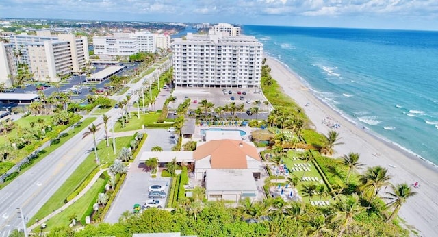 birds eye view of property featuring a water view and a view of the beach