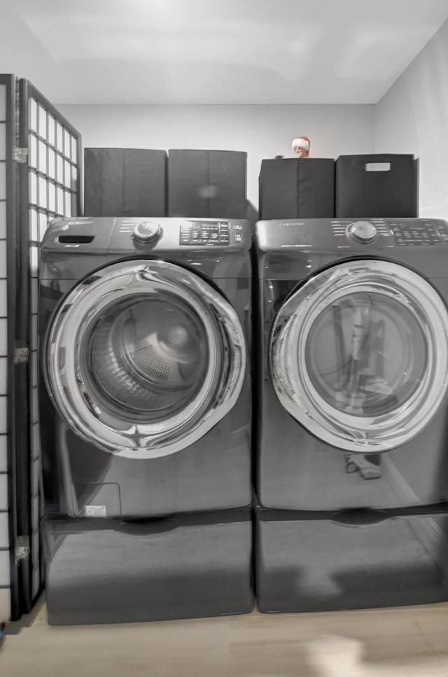 laundry area featuring washing machine and dryer