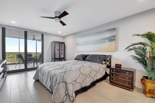 bedroom with ceiling fan, access to exterior, floor to ceiling windows, and light hardwood / wood-style floors