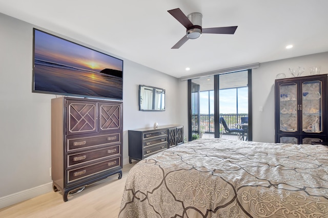 bedroom with ceiling fan, expansive windows, access to exterior, and light hardwood / wood-style flooring