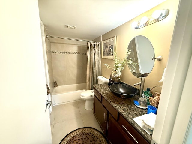 full bathroom featuring tile patterned flooring, vanity, toilet, and shower / bath combo