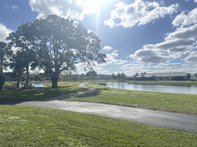 exterior space featuring a yard and a water view