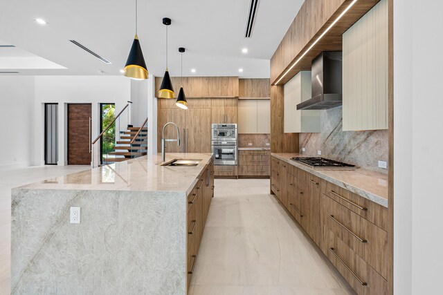3100 Palm Dr, Delray Beach, FL 33483 - kitchen featuring marble finish floor, stainless steel appliances, a sink, modern cabinets, and wall chimney exhaust hood