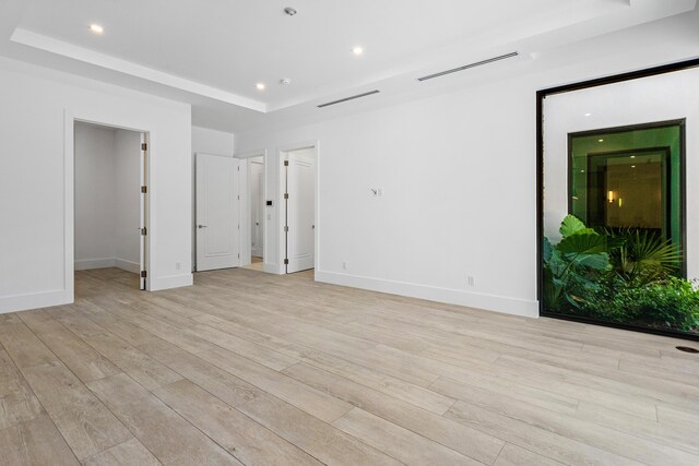 3100 Palm Dr, Delray Beach, FL 33483 - interior space with light wood-style flooring, baseboards, visible vents, recessed lighting, and a raised ceiling