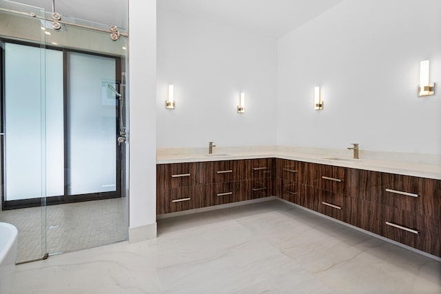 3100 Palm Dr, Delray Beach, FL 33483 - full bath featuring a freestanding tub, marble finish floor, a sink, and double vanity