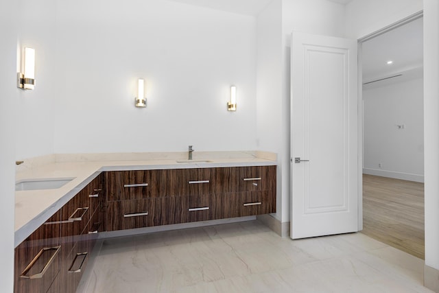3100 Palm Dr, Delray Beach, FL 33483 - bathroom featuring baseboards, marble finish floor, and vanity