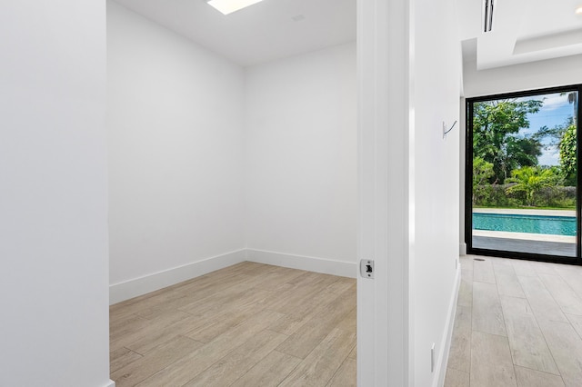 3100 Palm Dr, Delray Beach, FL 33483 - empty room featuring baseboards and light wood-type flooring