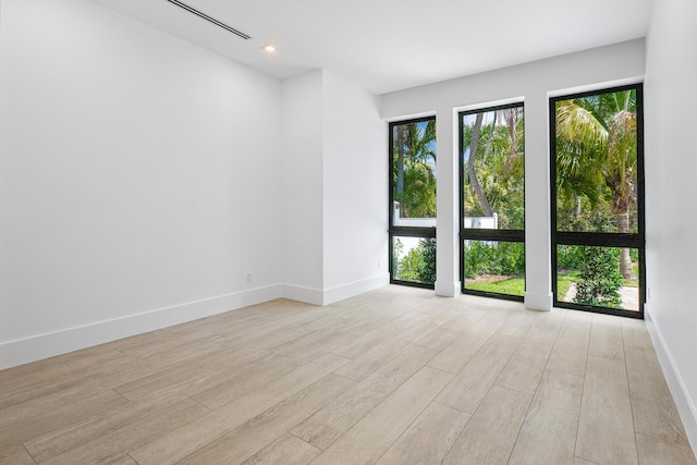 3100 Palm Dr, Delray Beach, FL 33483 - empty room featuring baseboards, light wood finished floors, and recessed lighting