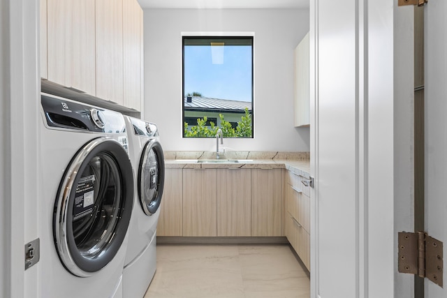 3100 Palm Dr, Delray Beach, FL 33483 - clothes washing area with cabinet space, marble finish floor, washer and dryer, and a sink
