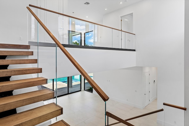 3100 Palm Dr, Delray Beach, FL 33483 - staircase with a towering ceiling, visible vents, recessed lighting, and a healthy amount of sunlight