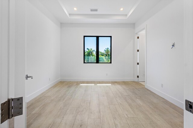 3100 Palm Dr, Delray Beach, FL 33483 - spare room featuring recessed lighting, a raised ceiling, visible vents, light wood-style floors, and baseboards