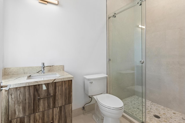 3100 Palm Dr, Delray Beach, FL 33483 - full bathroom featuring toilet, vanity, tile patterned floors, and a stall shower