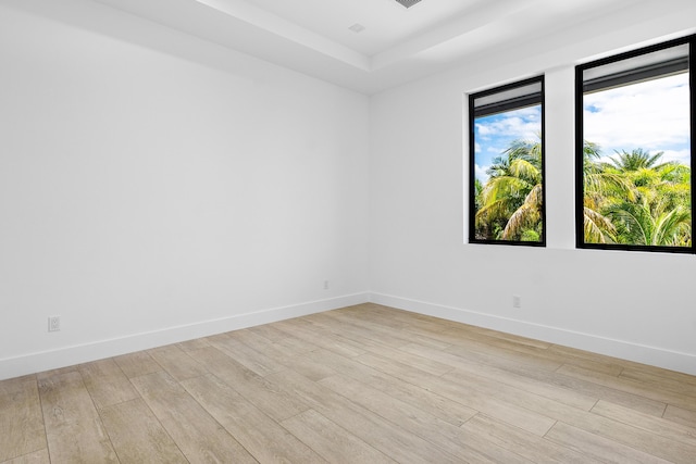 3100 Palm Dr, Delray Beach, FL 33483 - unfurnished room with light wood finished floors, baseboards, and a raised ceiling