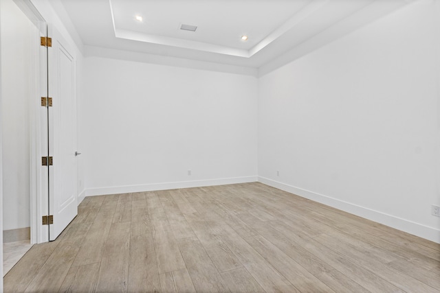 3100 Palm Dr, Delray Beach, FL 33483 - spare room featuring recessed lighting, a raised ceiling, light wood-style flooring, and baseboards