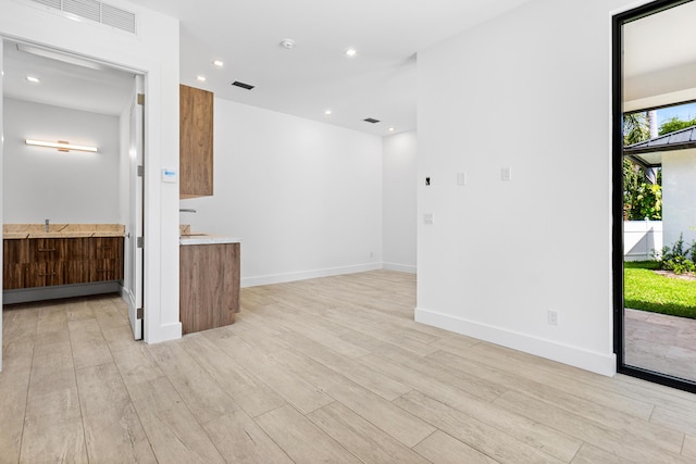 3100 Palm Dr, Delray Beach, FL 33483 - empty room with light wood-type flooring, baseboards, visible vents, and recessed lighting