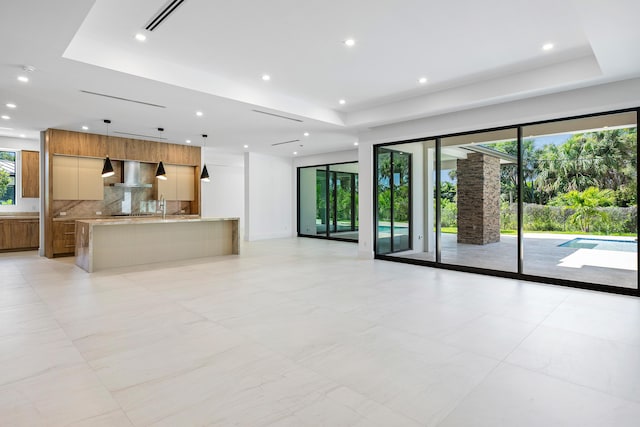 3100 Palm Dr, Delray Beach, FL 33483 - unfurnished living room with visible vents, recessed lighting, and a raised ceiling