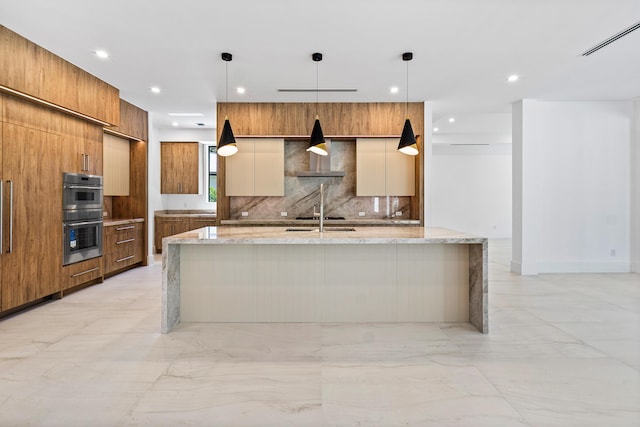 3100 Palm Dr, Delray Beach, FL 33483 - kitchen with modern cabinets, marble finish floor, tasteful backsplash, and stainless steel double oven