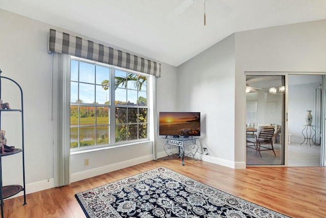 sitting room featuring hardwood / wood-style flooring, ceiling fan, and vaulted ceiling