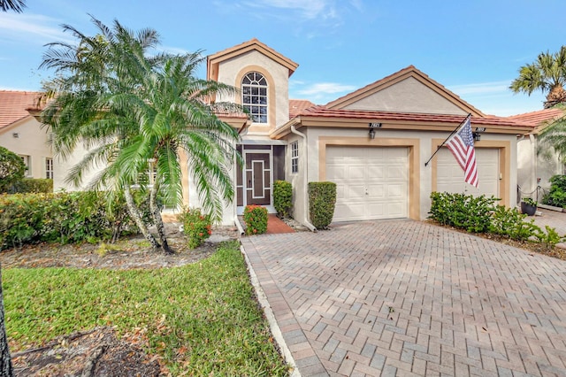 view of front of property with a garage