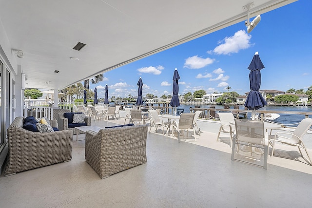 view of patio featuring a water view